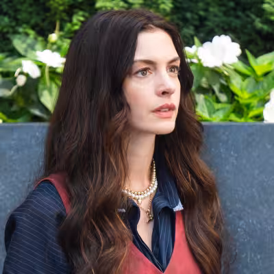 Stanley Tucci gets swept into Anne Hathaway’s sweater joke on Colbert