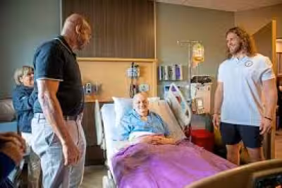 Lynn Swann visits UPMC Hillman patients for Crucial Catch on draft day