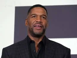 Michael Strahan marks 10 years of his brand with a red-suit post
