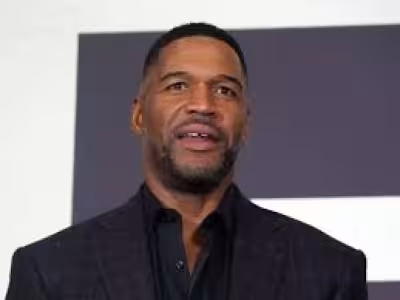 Michael Strahan marks 10 years of his brand with a red-suit post