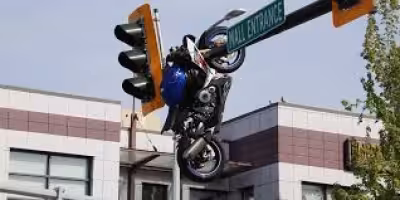 Motorcycle Hanging From Traffic Light After Delta Crash Injures Rider